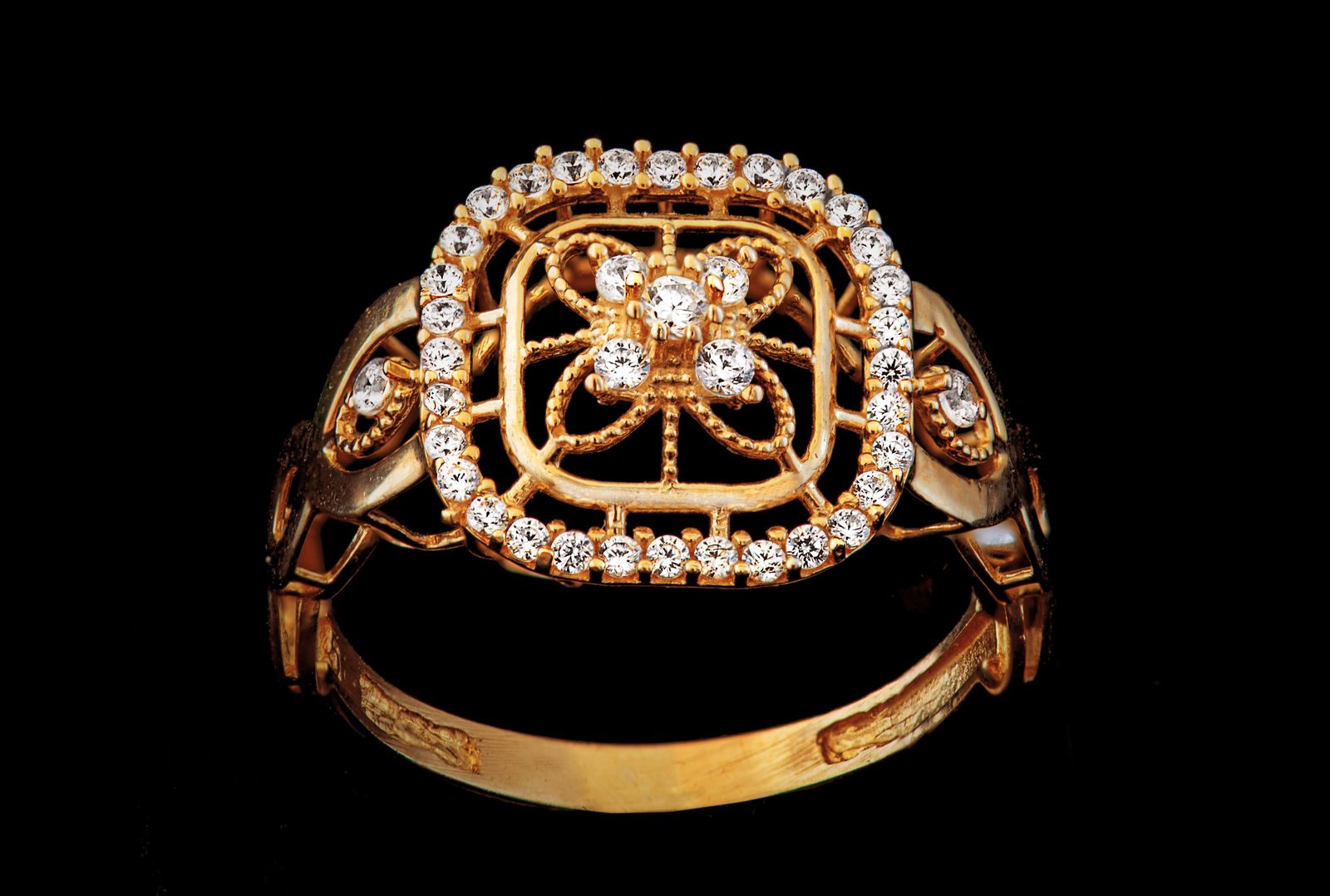 Gold filigree ring with diamond halo