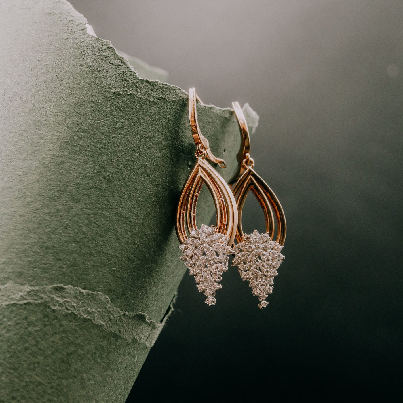 Gold drop earrings with diamond clusters