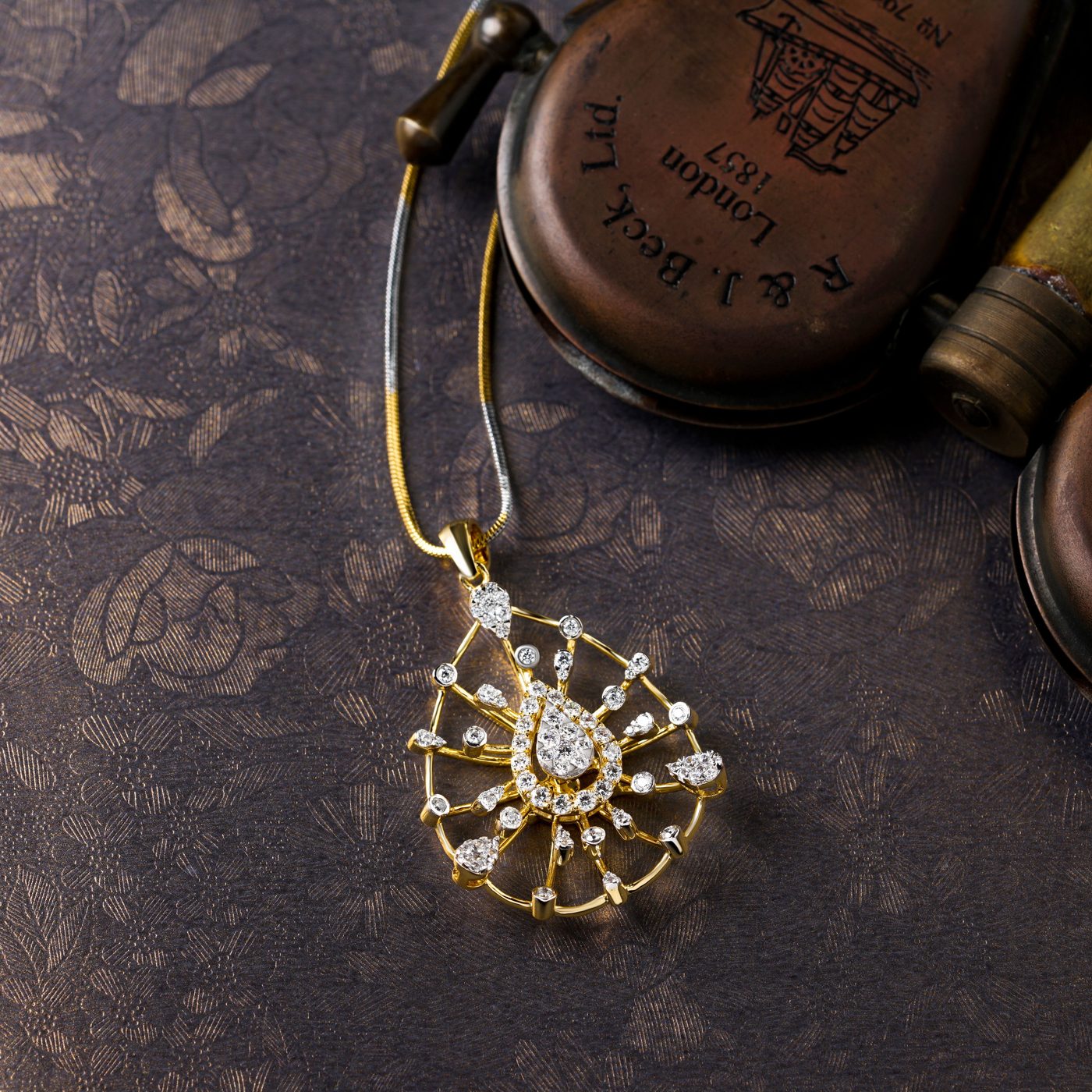 Gold pear-shaped diamond pendant necklace