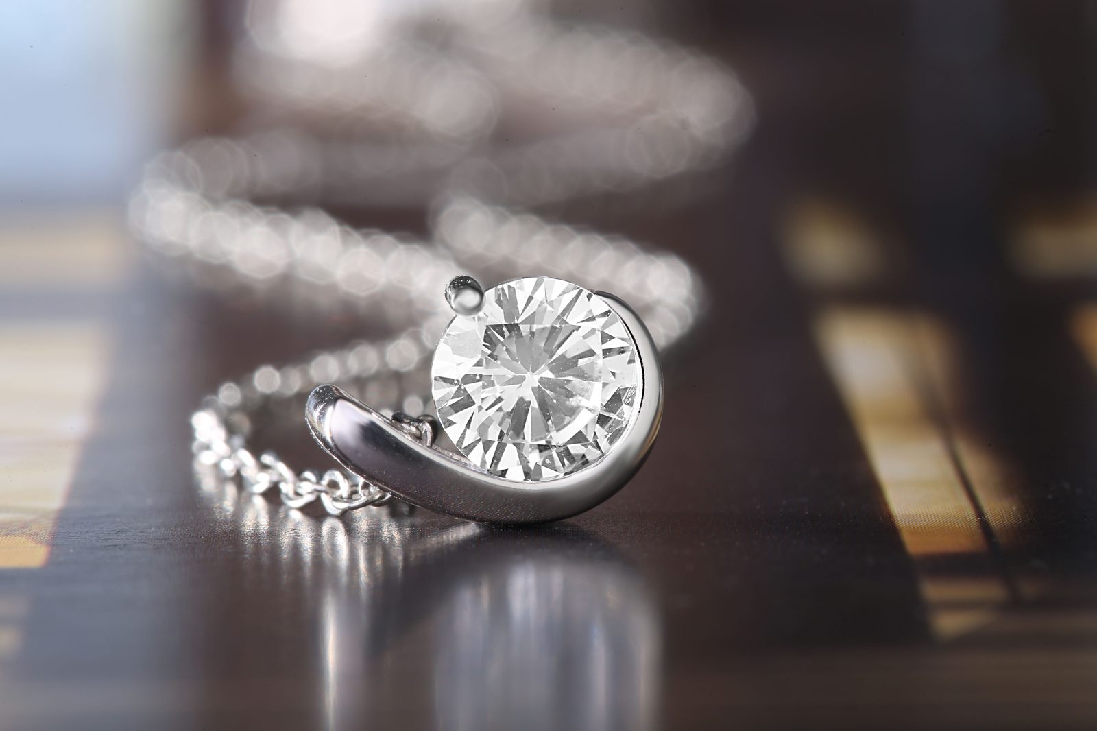 Solitaire ring and pendant polished to a mirror finish