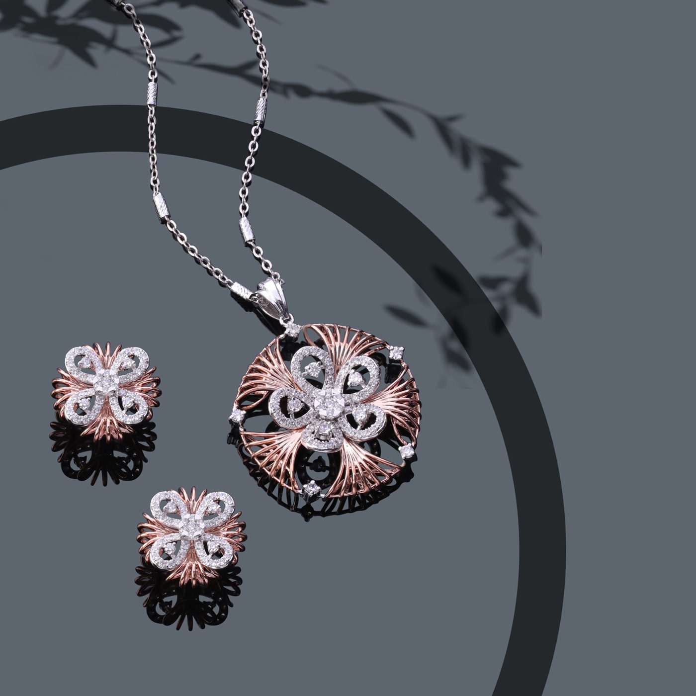 Rose gold and diamond flower pendant and earring set